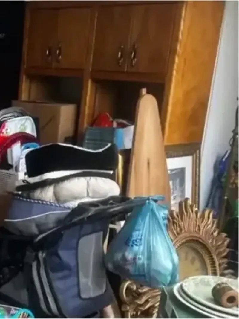 A garage packed floor to ceiling with boxes bags and household items