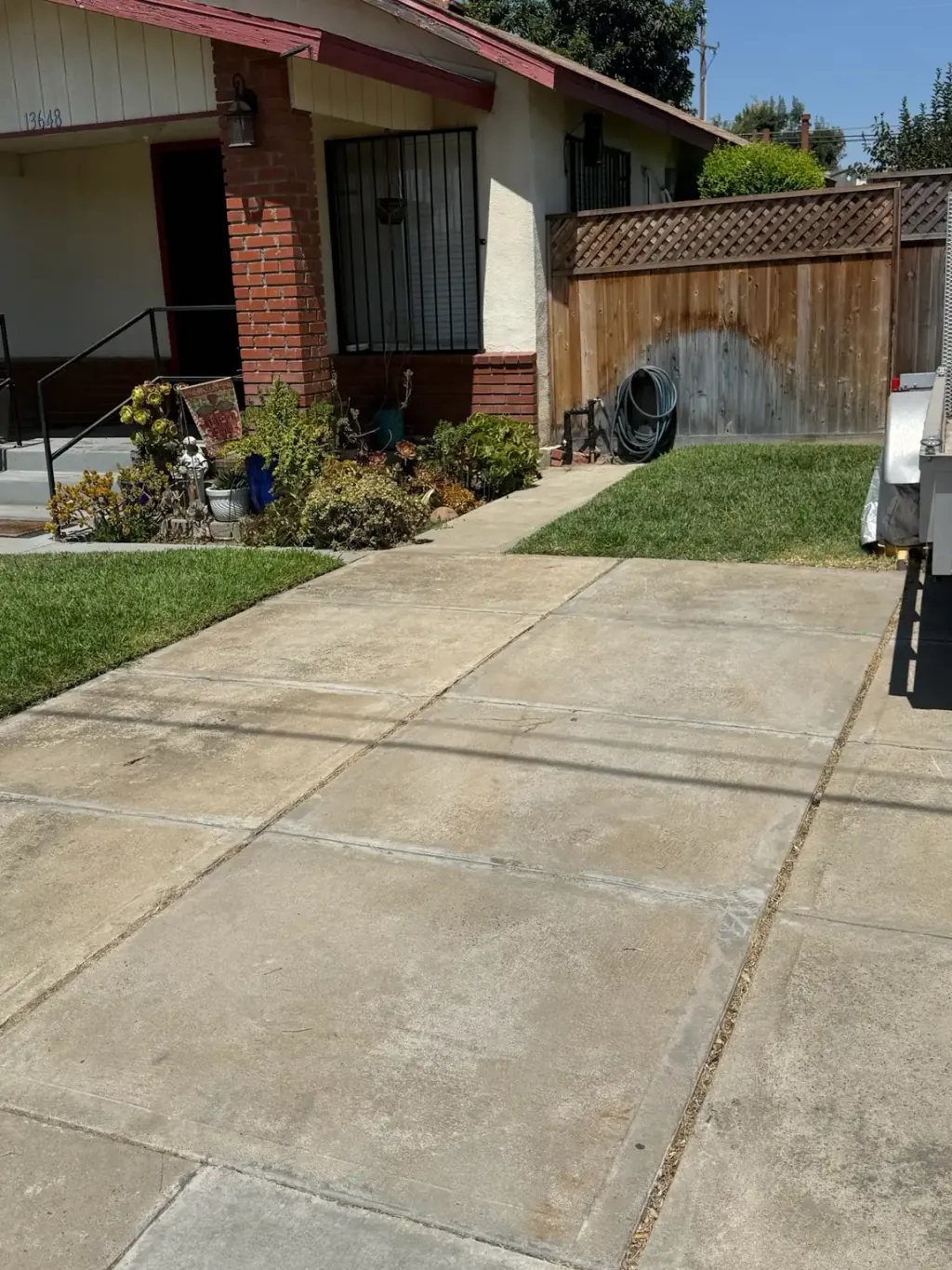A driveway and front walk left clear after a full cleanout