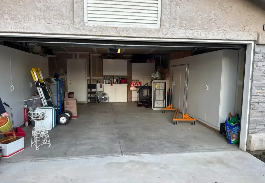 The same garage emptied and swept, with the floor clear again